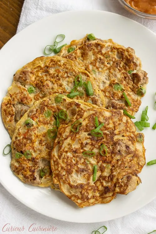 Tortang Giniling is a Filipino ground beef omelette. It is unique in that the omelette is made more like a fritter and is filled with lots of beef and veggies. It is a delicious recipe for breakfast or for a light lunch or snack.  | www.CuriousCuisiniere.com