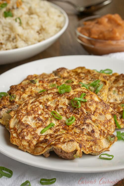 Tortang Giniling is a Filipino ground beef omelette. It is unique in that the omelette is made more like a fritter and is filled with lots of beef and veggies. It is a delicious recipe for breakfast or for a light lunch or snack.  | www.CuriousCuisiniere.com