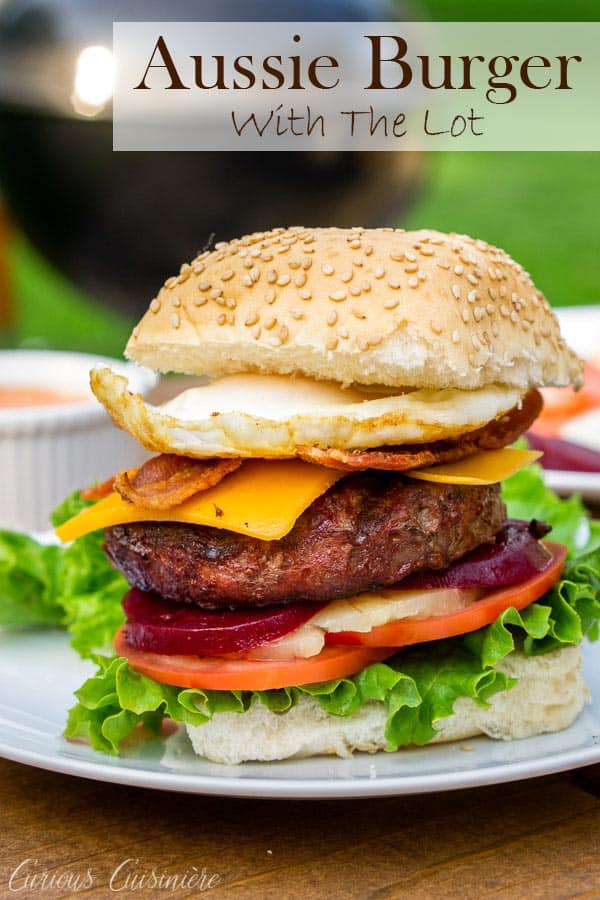 This loaded Australian Hamburger is a mile-high burger with egg, bacon, cheddar cheese, pineapple, pickled beets, sweet onion, lettuce, tomato, and a chili mayo sauce. If you love burger toppings, this Aussie Burger is for you! #hamburger #grilling #loadedburger | www.CuriousCuisiniere.com