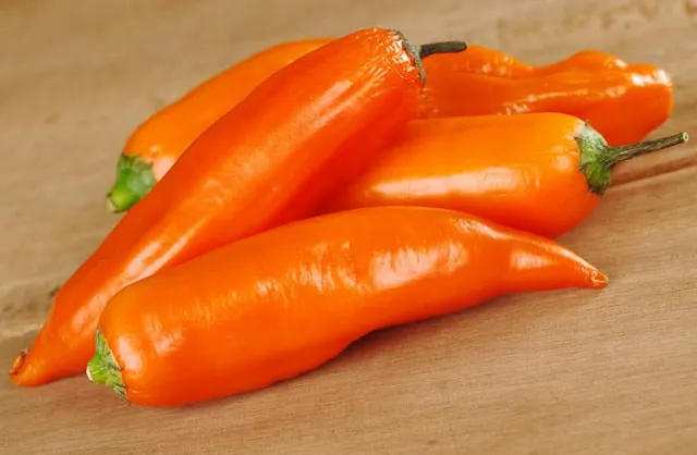 Aji Amarillo - Native to South America, these bright orange chiles have a thick flesh and a hot heat level. 