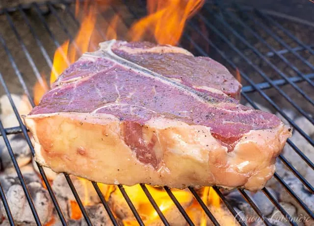 Bistecca alla Fiorentina is an impressive dish of Porterhouse steak done Florentine style. This Florentine steak is a simple recipe, perfect for a summer dinner party. | www.CuriousCuisiniere.com 