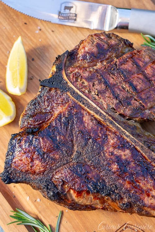 Bistecca alla Fiorentina is an impressive dish of Porterhouse steak done Florentine style. This Florentine steak is a simple recipe, perfect for a summer dinner party. | www.CuriousCuisiniere.com 