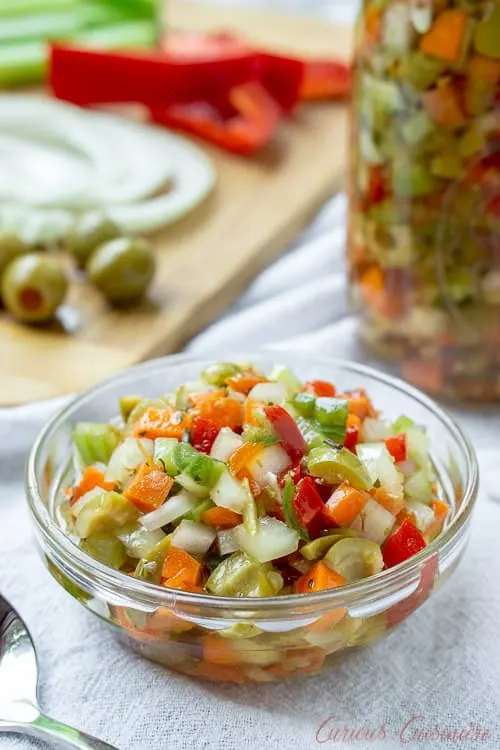 Chicago Style Hot Giardiniera Relish uses diced vegetables and ample hot peppers to create a tangy and spicy topping for sandwiches, hot dogs, and more. | www.CuriousCuisiniere.com