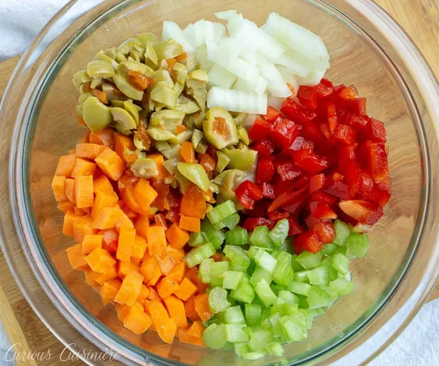 Hot Giardiniera Relish uses diced vegetables and ample hot peppers to create a tangy and spicy topping for sandwiches, hot dogs, and more. | www.CuriousCuisiniere.com