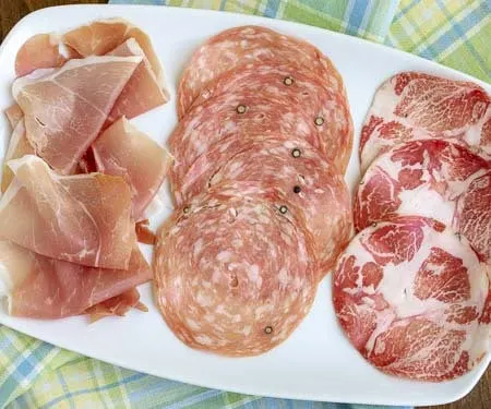 Have you heard of salumi? Hint, it's not salami. Here's what you need to know about these tasty Italian cured meats. | www.CuriousCuisiniere.com