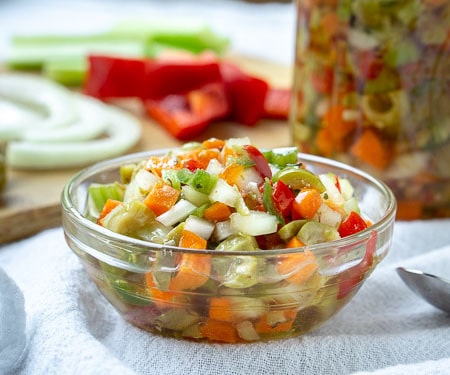 Hot Giardiniera Relish uses diced vegetables and ample hot peppers to create a tangy and spicy topping for sandwiches, hot dogs, and more. | www.CuriousCuisiniere.com