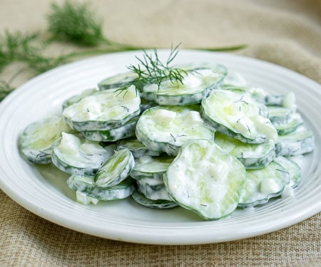 Gurkensalat is a creamy German Cucumber Salad that is the perfect balance of creamy and crisp. It is a great summer side dish recipe for your cookout or potluck dinner!  | www.CuriousCuisiniere.com