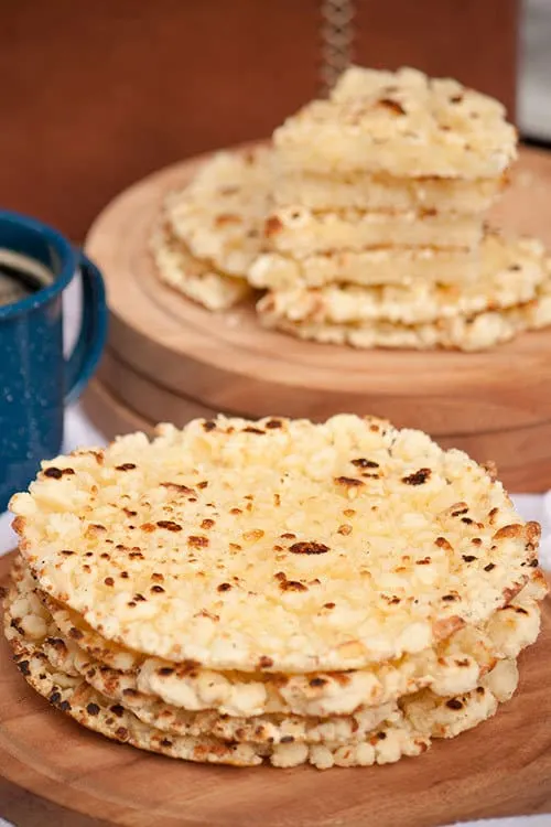 Mbej&uacute; is a buttery, gluten-free, cheese flatbread with crispy edges that is made with cassava flour and enjoyed all over Paraguay with a cup of coffee or cocido tea. | www.CuriousCuisiniere.com 