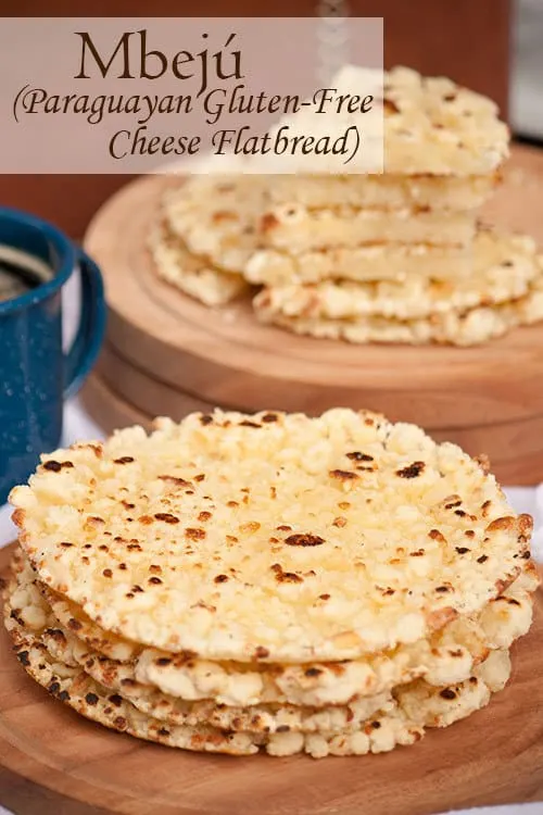 Mbejú is a buttery, gluten-free, cheese flatbread with crispy edges that is made with cassava flour and enjoyed all over Paraguay with a cup of coffee or cocido tea. #flatbread #fallbread #cheesebread #appetizer | www.CuriousCuisiniere.com 