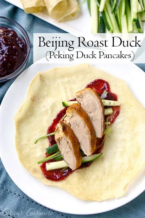 Beijing Roast Duck, also known as Peking Duck is a delicious way to prepare roast duck. It is traditionally served as Peking Duck pancakes, wrapped in Mandarin pancakes along with cucumber and plum or hoisin sauce. This recipe is easier than many traditional methods, but still yields a delicious duck, full of the classic flavors. | www.CuriousCuisiniere.com 