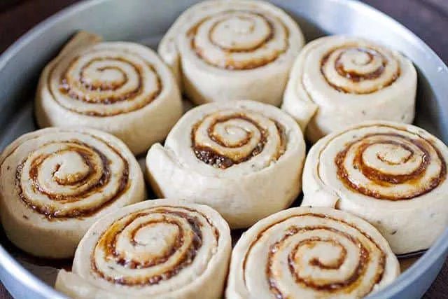 Golfeados Venezuelan Sticky Buns in the pan before baking | www.CuriousCuisiniere.com