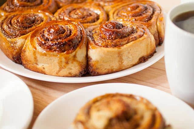 Golfeados Venezuelan Sticky Buns served with coffee | www.CuriousCuisiniere.com