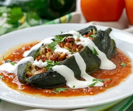 Baked Chiles Rellenos, filled with chorizo, rice, and melted cheese, are an easy way to enjoy Mexican stuffed peppers without all the hassle of frying. | www.CuriousCuisiniere.com