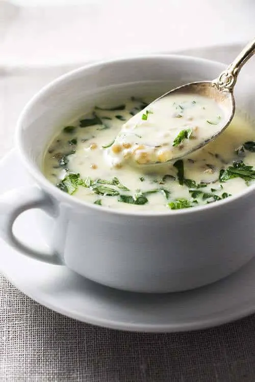 If you're looking for comfort food, whip up a bowl of this Armenian Yogurt Soup, called Spas. This simple dish gets wonderful flavor from yogurt and herbs and texture from wheat berries.  | www.CuriousCuisiniere.com