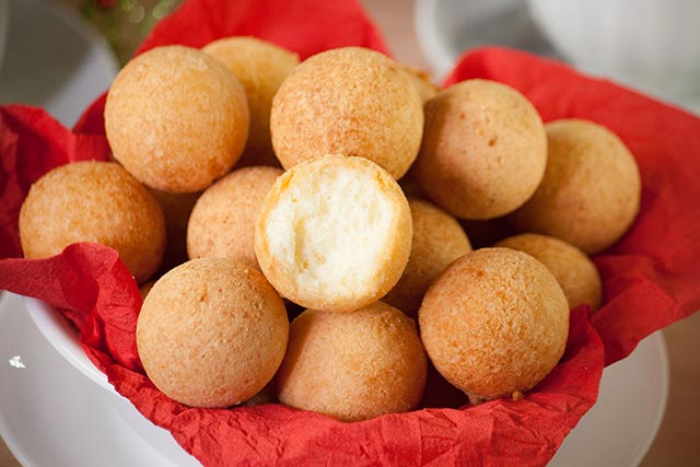 Colombian buñuelos or cheese fritters, are a mouthful of textures and flavors. They have a soft crumb and a crispy crust with a hint of sweetness and are a typical Colombian Christmas treat. | www.CuriousCuisiniere.com