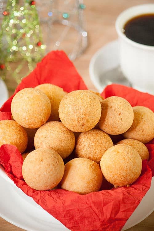 Colombian buñuelos or cheese fritters, are a mouthful of textures and flavors. They have a soft crumb and a crispy crust with a hint of sweetness and are a typical Colombian Christmas treat. | www.CuriousCuisiniere.com