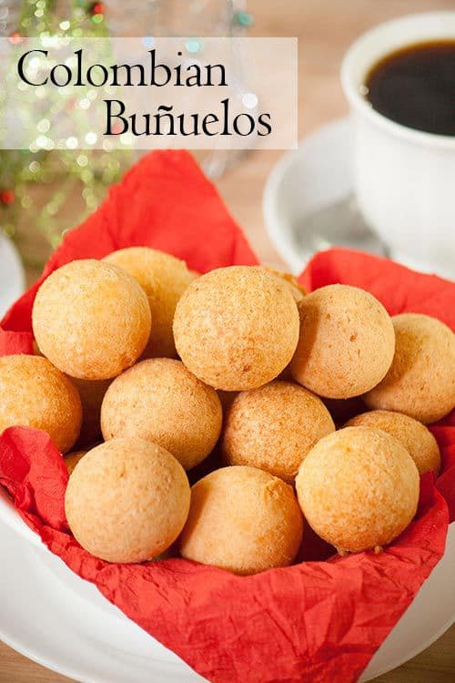 Colombian buñuelos or cheese fritters, are a mouthful of textures and flavors. They have a soft crumb and a crispy crust with a hint of sweetness and are a typical Colombian Christmas treat. | www.CuriousCuisiniere.com