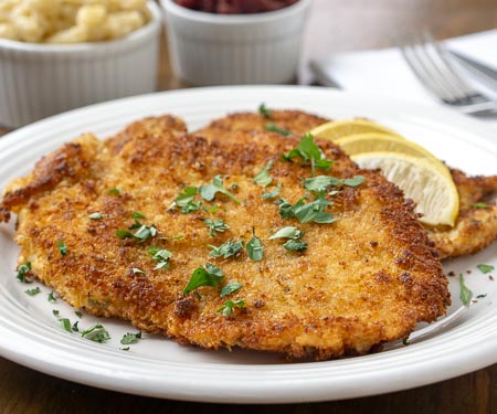 Hänchen-Schnitzel, German Chicken Schnitzel ,is an impressive, yet easy easy dinner recipe that the whole family will love. | www.CuriousCuisiniere.com