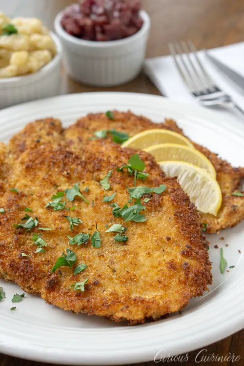 Hänchen-Schnitzel, German Chicken Schnitzel ,is an impressive, yet easy dinner recipe that the whole family will love. | www.CuriousCuisiniere.com