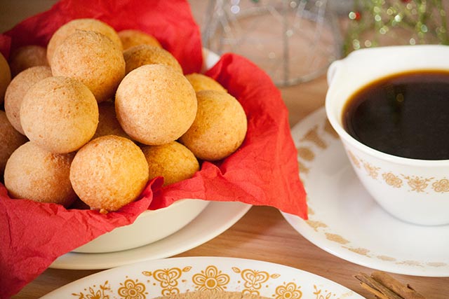 Natilla is a firm milk custard infused with cinnamon and served with buñuelos (fritters) during Christmas time in Colombia. | www.CuriousCuisiniere.com
