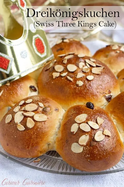 Dreikönigskuchen, Three Kings Cake, may also be called an Epiphany cake. These citrus and raisin bread rolls are lightly sweet and wonderfully fluffy! | www.CuriousCuisiniere.com