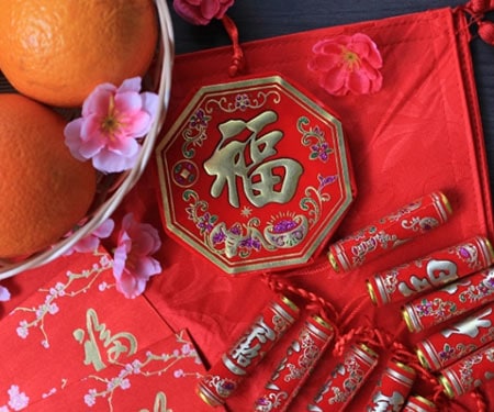 Firecrackers and mandarin oranges for the Chinese New Year