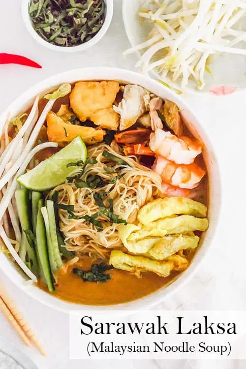 Sarawak Laksa is a comforting Malaysian noodle soup with Thai chiles, ginger, tamarind, and coconut milk. It is spicy, bright, warming, and full of flavour. | www.CuriousCuisiniere.com 