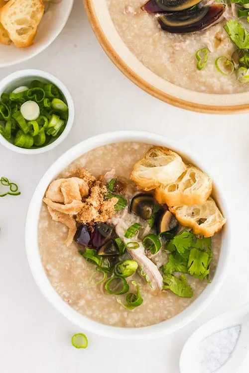 Pork congee with preserved century eggs. | www.CuriousCuisiniere.com