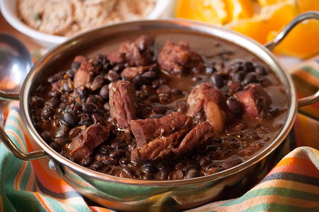 Feijoada, Brazilian black bean stew served with farofa and orange slices