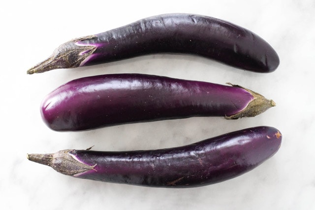 Three purple Chinese eggplant