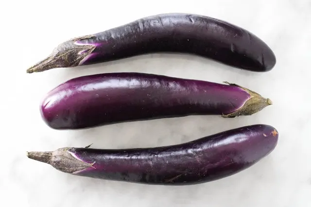 Three purple Chinese eggplant