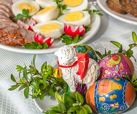 Easter lamb statue with painted Easter eggs.