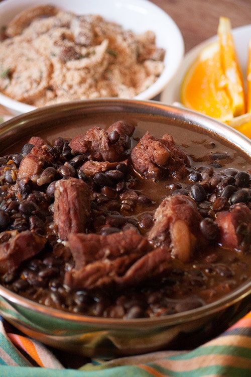 Feijoada, Brazilian black bean stew served with farofa and orange slices