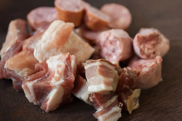 Slab bacon, diced on a cutting board