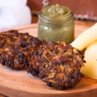 Asaditos (Bolivian Cassava and Beef Fritters) with boiled cassava and spicy sauce