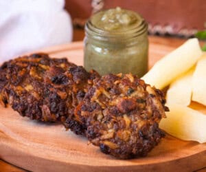 Asaditos (Bolivian Cassava and Beef Fritters) with boiled cassava and spicy sauce