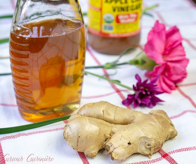 A jar of honey and piece of ginger for Carribean Switchel