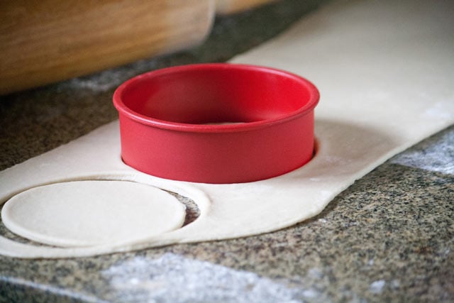 Cutting false puff pastry empanada dough