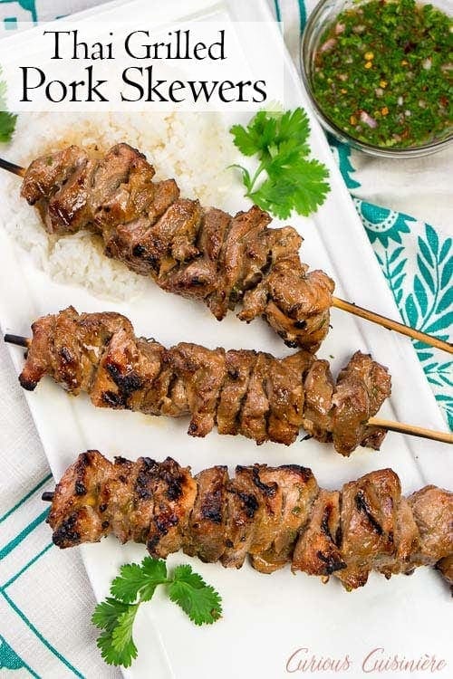 Thai pork kabobs with rice and dipping sauce 