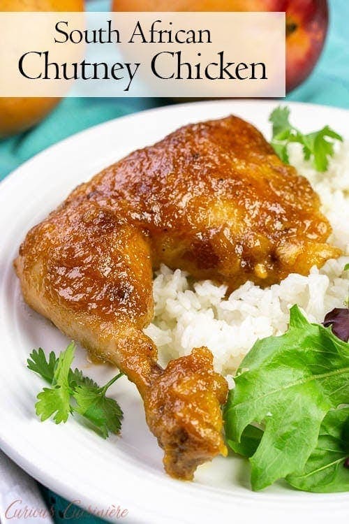 chicken on a white plate with salad with text overlay