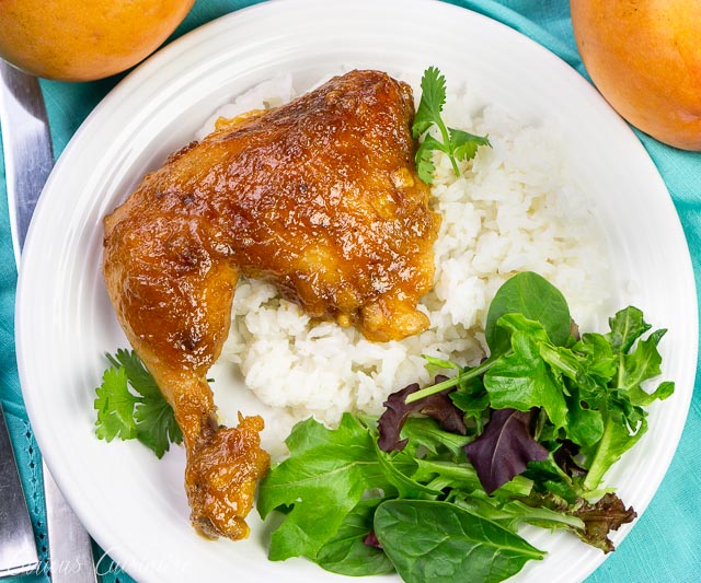 chicken on a white plate with salad