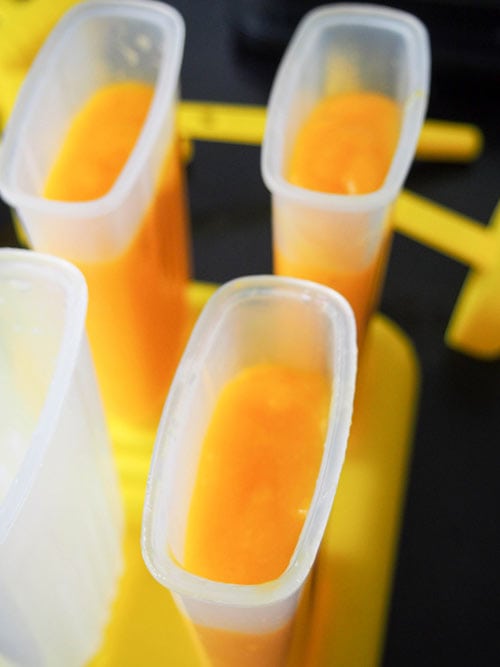 Filling ice pop moulds