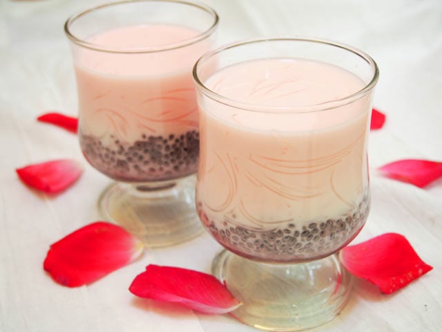 Falooda Indian rose drinks surrounded by rose petals