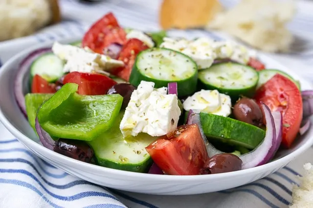 Authentic Greek salad (Horiatiki), a chunky salad without lettuce. Summer vegetables, salty olives, and creamy feta cheese.