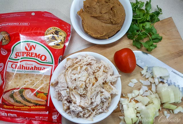 Ingredients for chicken chimichangas: chicken, onions, refried beans and cheese