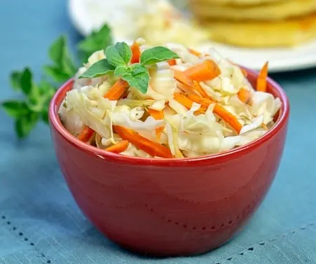 El Salvadoran Curdito pickled cabbage and carrot slaw in a red bowl small image