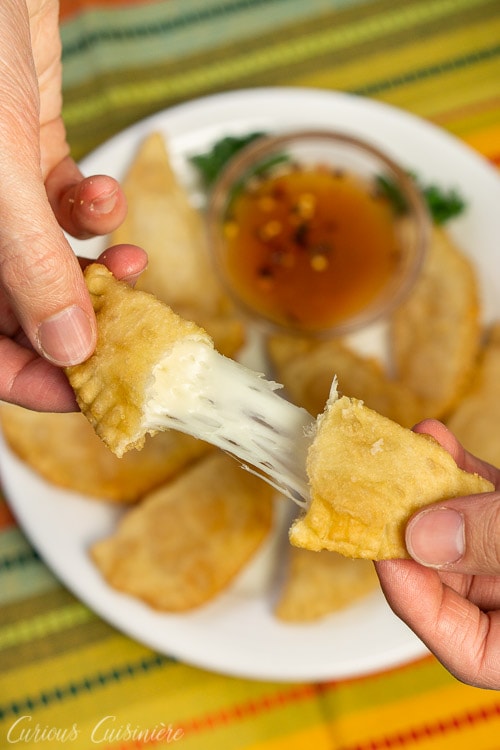 Brazilian Pastel de Queijo (Cheese Pastries) cheese pull shot