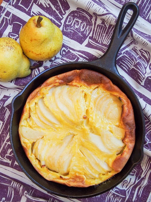 Pear clafoutis overhead picture in a cast iron skillet.