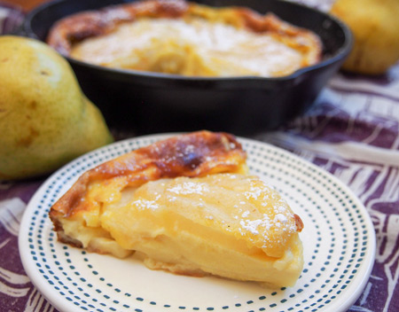 Slice of pear clafoutis.