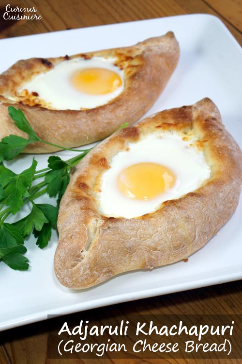 Soft bread, flavorful cheese, and a runny egg combine to make Adjaruli Khachapuri, a Georgian cheese bread that is sure to win your heart. | www.CuriousCuisiniere.com